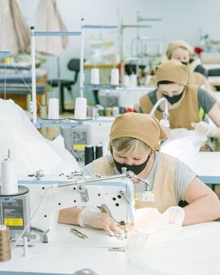 Machine operators working a production floor