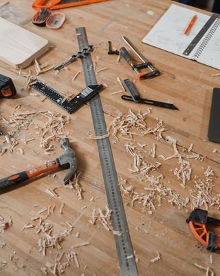 Tools and a rule laid out on a workbench